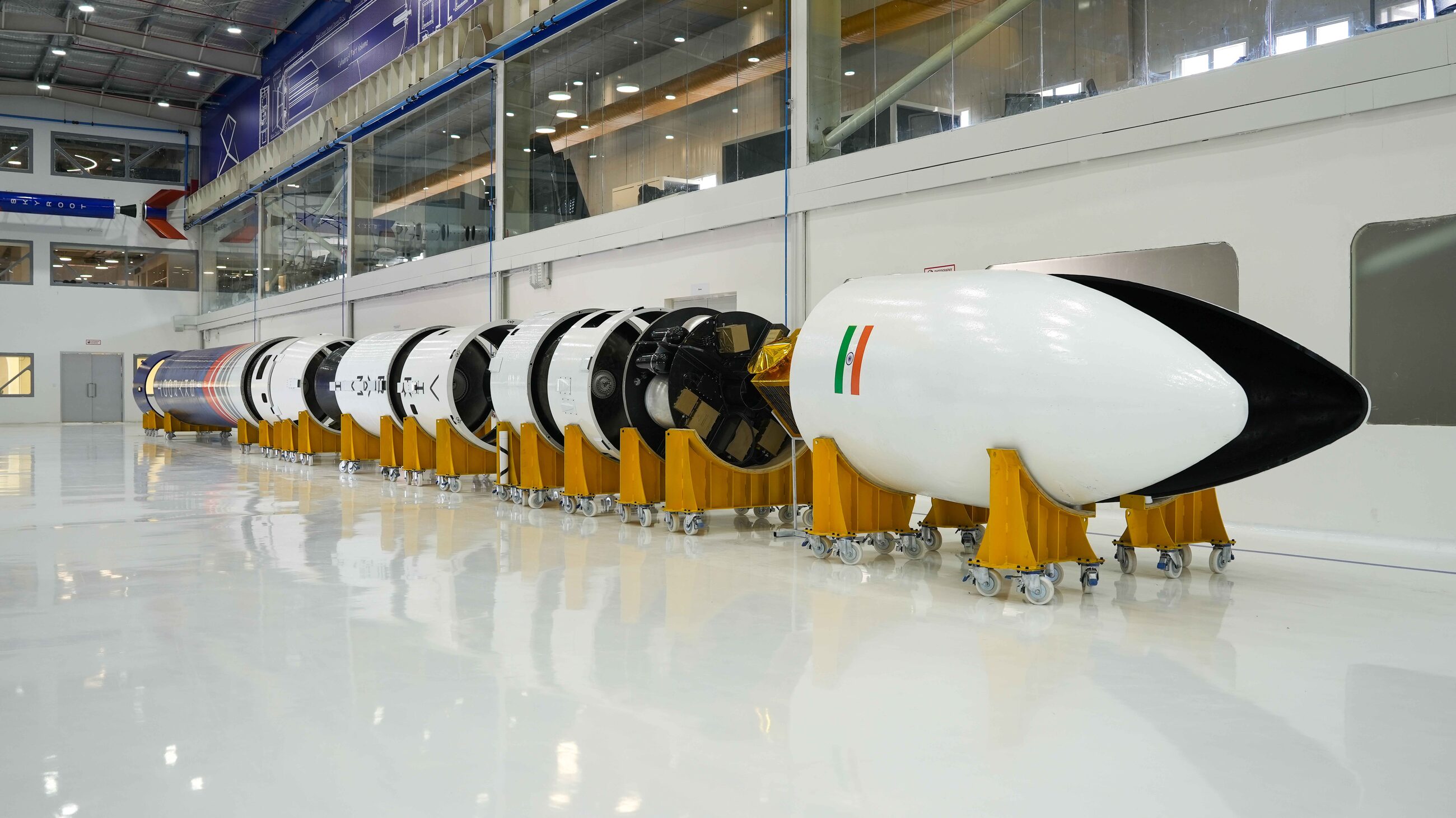 Close view of the Vikram-1 payload fairing with the Indian flag, stages receding behind it